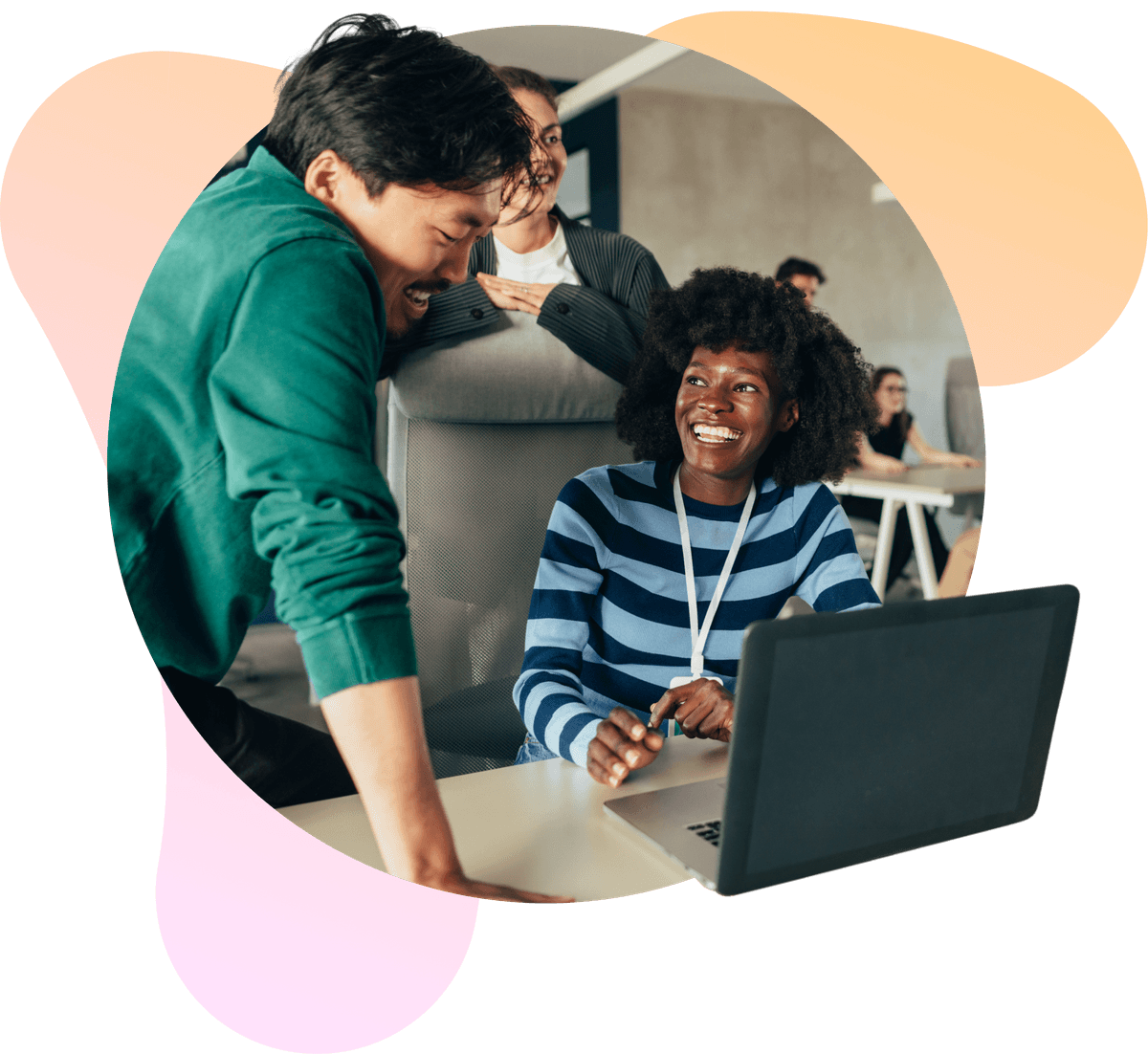 Diverse team members smiling and collaborating in an office.