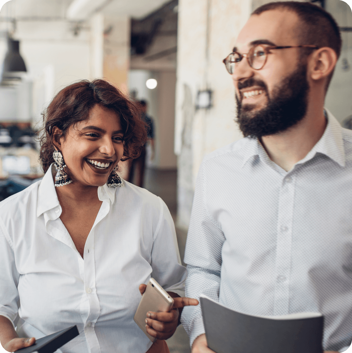a man and a woman are standing next to each other and smiling