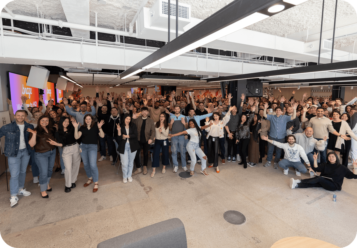 a big group of people posing for a picture in the office