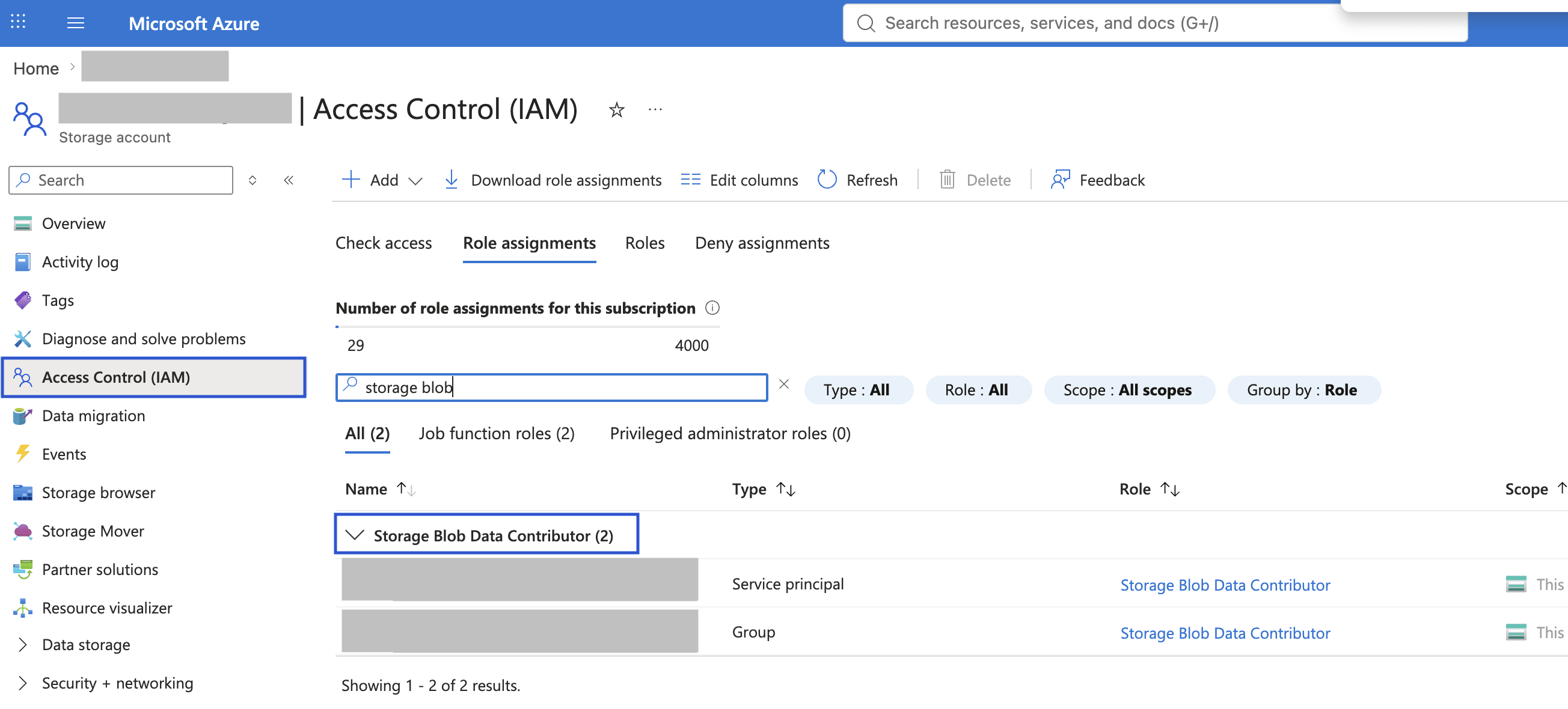 The Access Control (IAM) Role assignments tab for a storage account, showing a service principal and a group assigned the Storage Blob Data Contributor role.